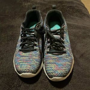 Sketchers lite-weight the memory foam multi coloured sneaker.